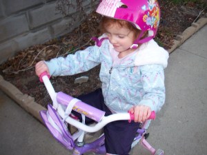 Maggie Riding Her Bike